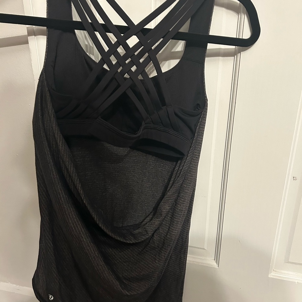 lululemon tank top. black with gray strips with bult in black sports bra
